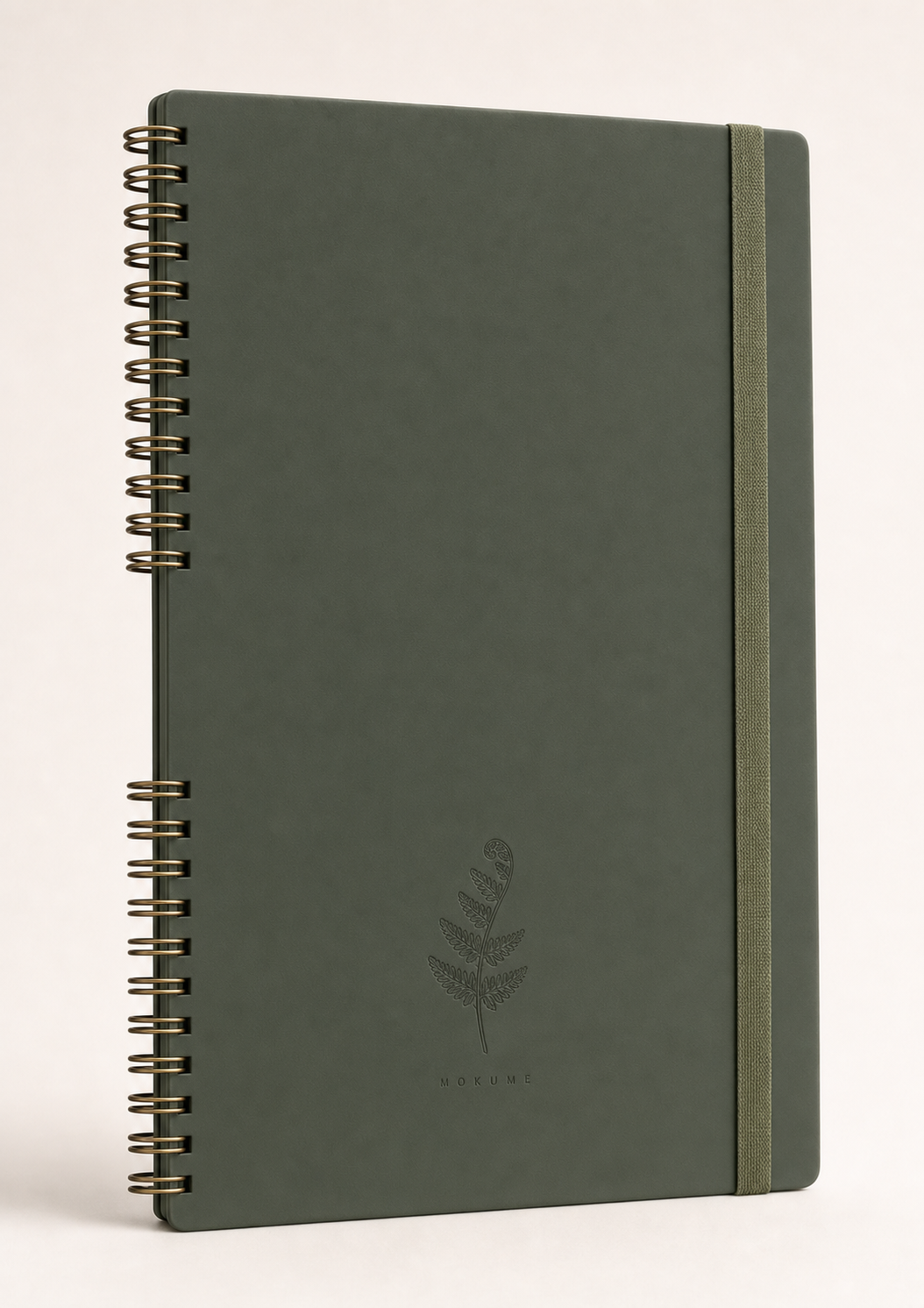 Mokume notebook — Forest Moss edition, deep green soft-touch cover with fern frond blind emboss